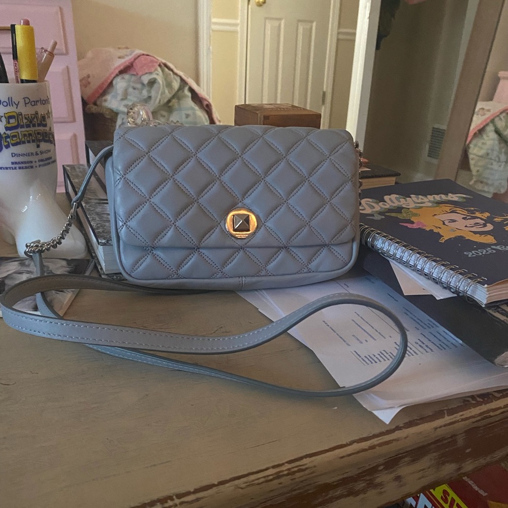 Blue-Gray Kate Spade New York crossbody bag w/detachable and adjustable straps.